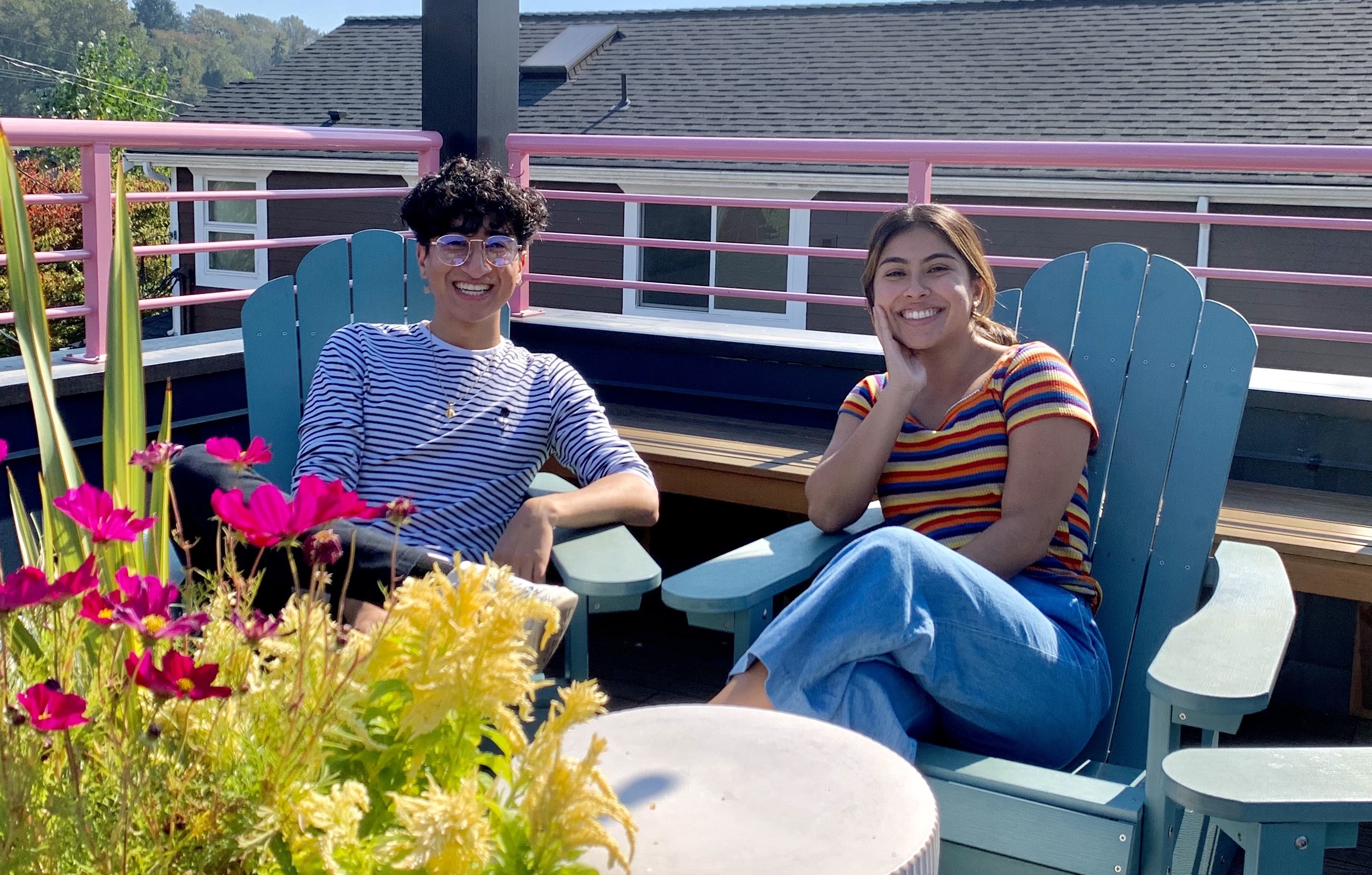 Ernesto & Juliet on a deck with flowers